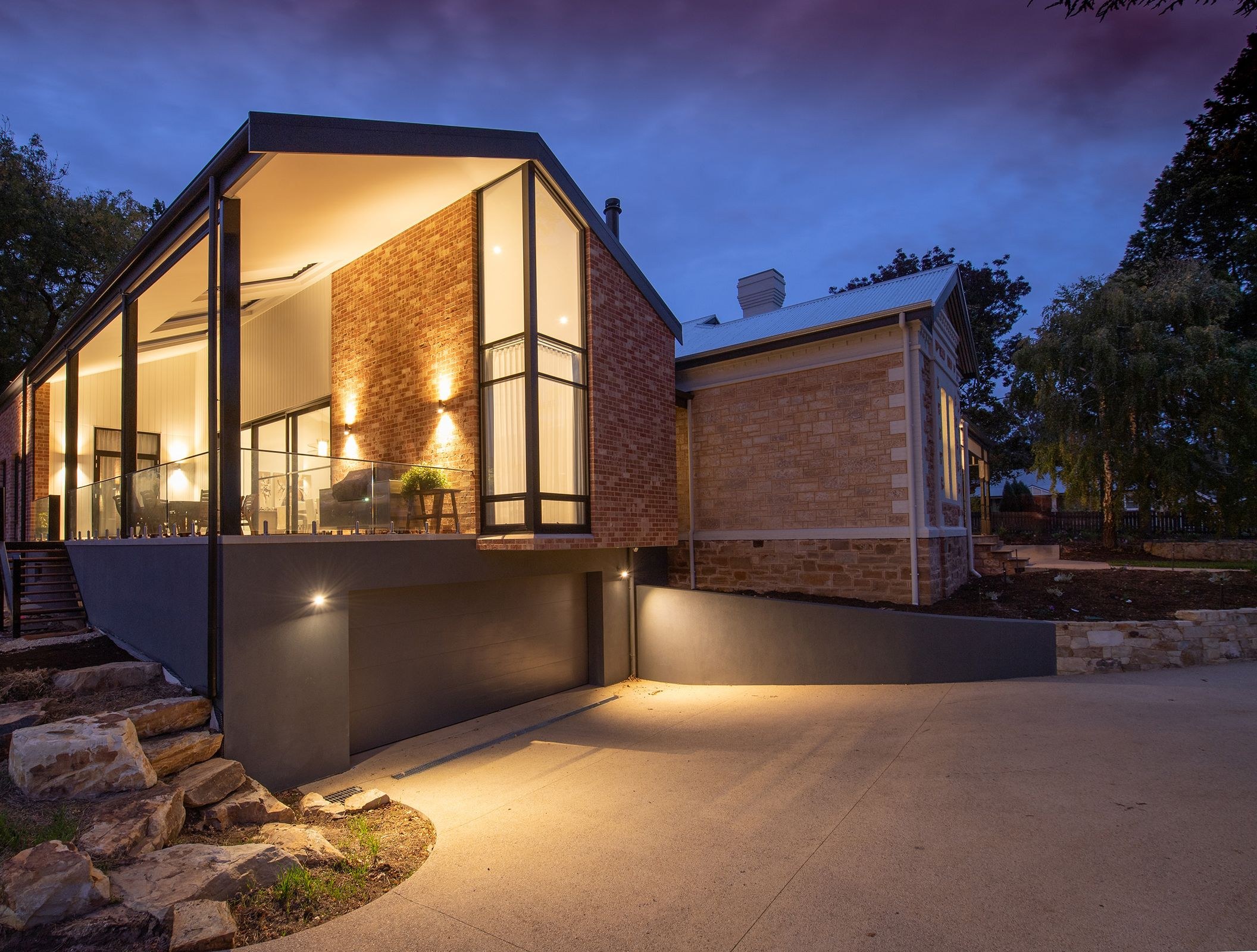Modern home fully lit at dusk, powered through any outage